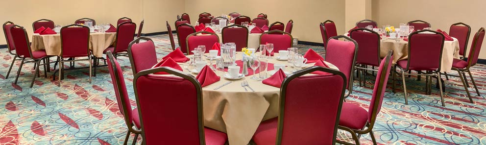 Round table set up for an event in the ballroom at the Days Inn Stephenville hotel