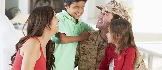 A happy family with their father who is in the military signifying the military specials at the Days Inn Stephenville